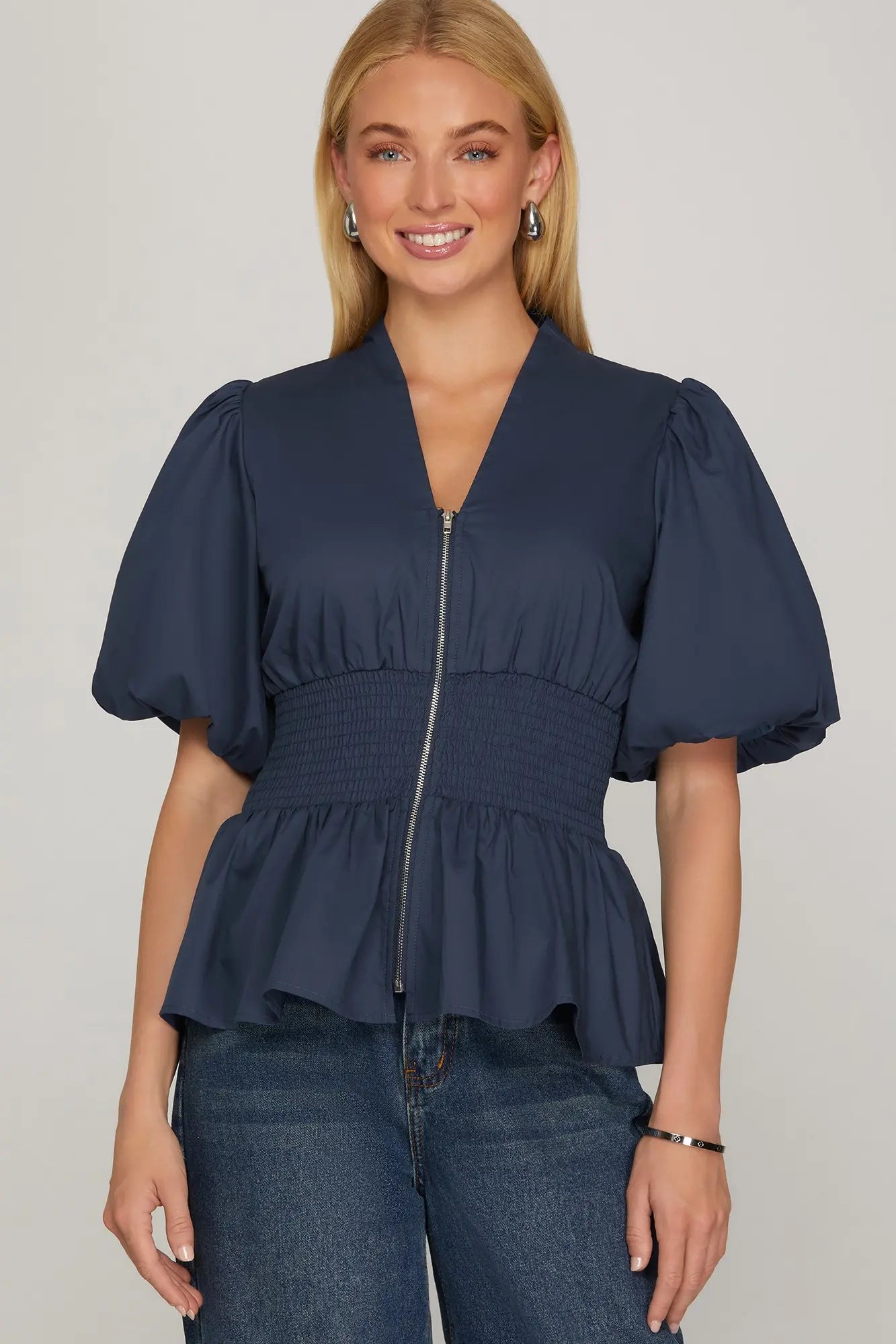 NAVY PUFF SLEEVE SMOCKING FRONT ZIPPER WOVEN TOP WITH ELASTIC WAISTBAND image 0