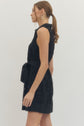 Solid sleeveless mini dress featuring floral lace overlay and self-tie belt at waist
