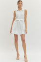 Solid sleeveless mini dress featuring floral lace overlay and self-tie belt at waist