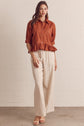 Solid Short Sleeve Button Down Top Featuring Ruffle Hem