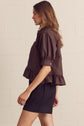 Solid Short Sleeve Button Down Top Featuring Ruffle Hem