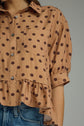 Polka Dot Top Featuring Ruffle Hem