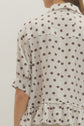 Polka Dot Short Sleeve Top with Ruffle Hem